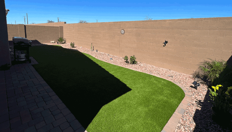 artificial-grass-and-rock-landscaping-say-goodbye-to-dead-brown-lawns-768x437