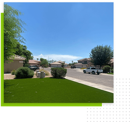 green-lawn-with-bushes-street-and-car