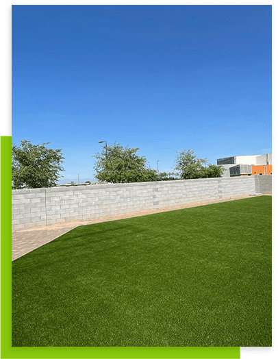 green-lawn-with-stone-fence