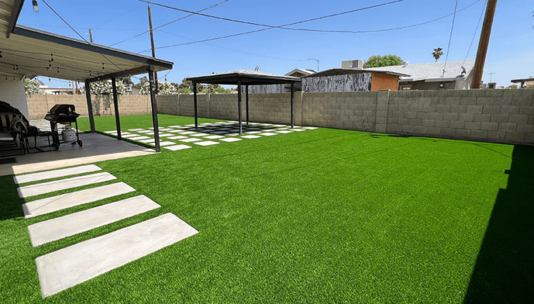 yard-with-pavers-stone-wall-and-grill-768x437