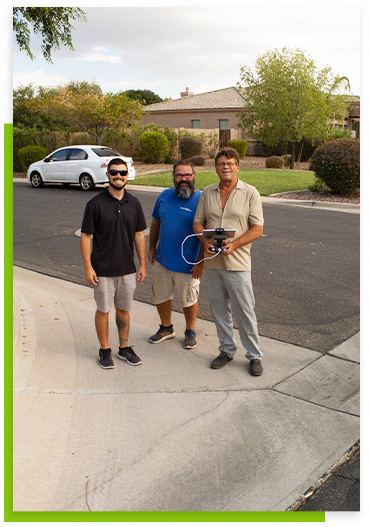 Three Men with a green lawn behind them