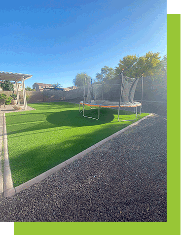 Always Green Turf | backyard with lawn and rock installation